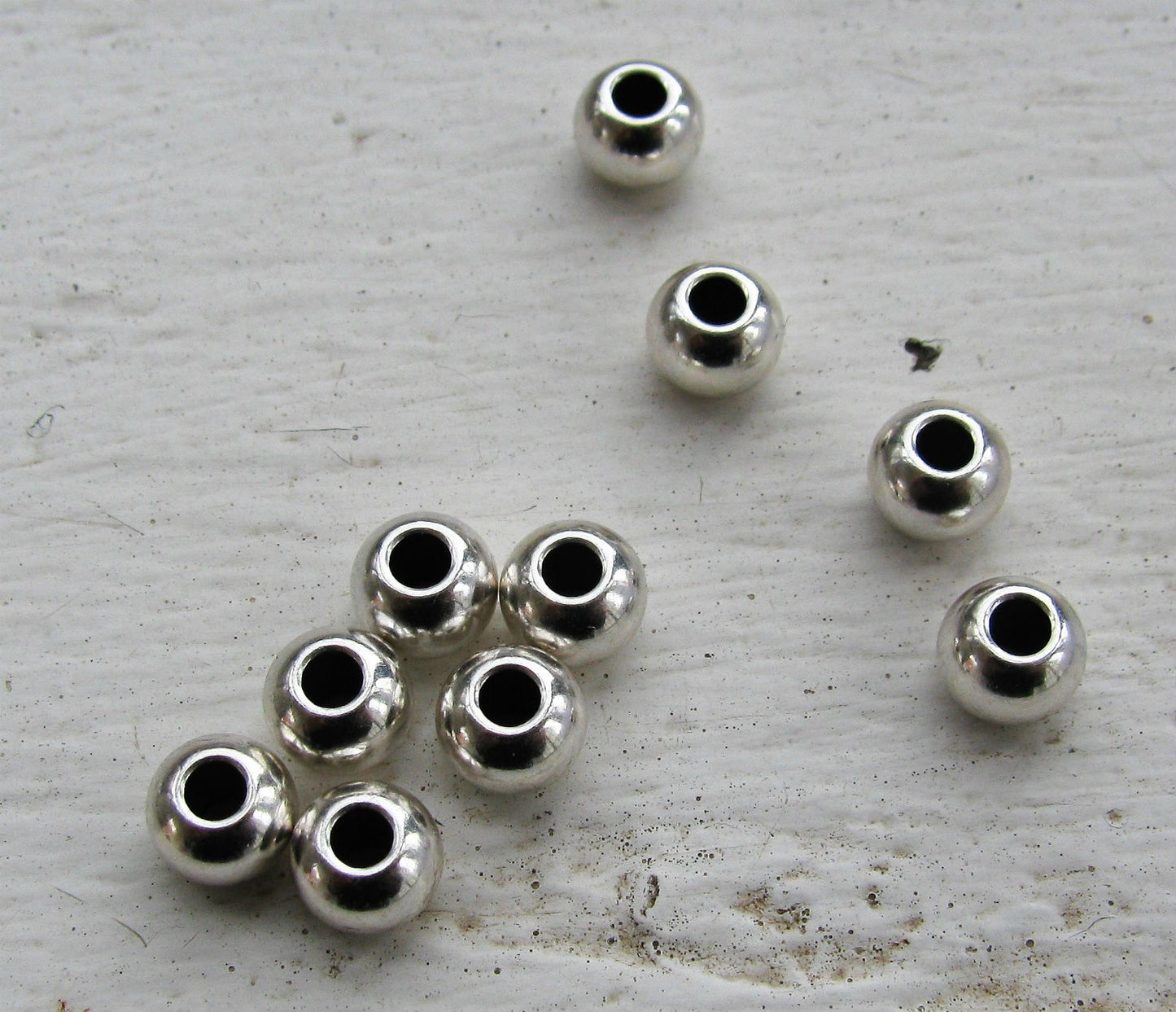 Mellandel silverfärgad - Rund med större hål, 6x4mm, 10-  pack