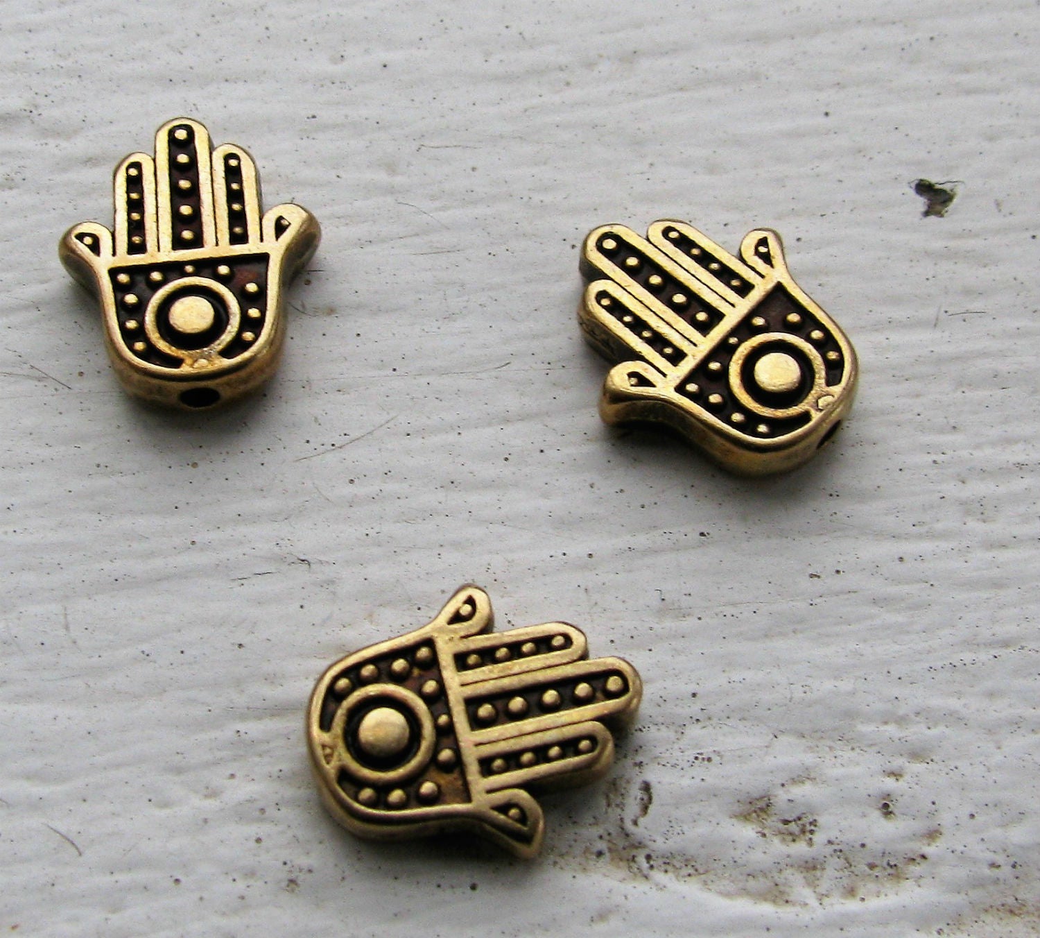 Mellandel bronsfärgad - Hamsa hand 12x10mm 3- pack