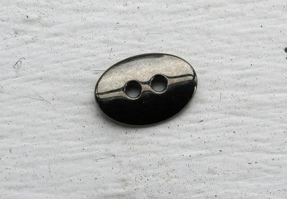 Metallknapp Guntmetallfärgad - Oval 14x10 mm, 1 styck