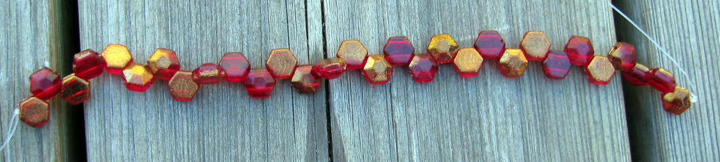 Honeycomb Jewel -  Ruby Bronze 6mm, 1 sträng