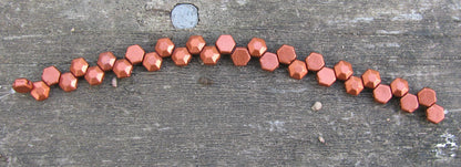 Honeycomb Jewel -  Bronze fire red  6mm, 1 sträng