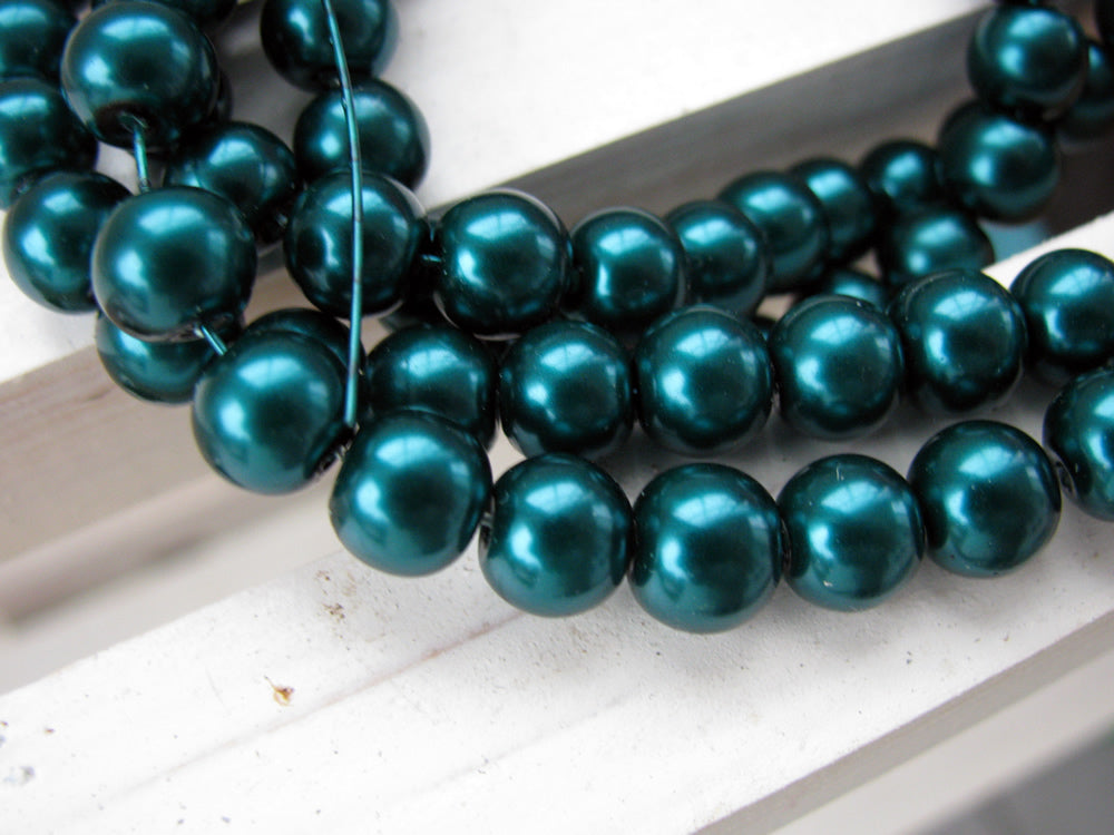 Vaxade glaspärlor - Mörk teal  8mm 1 sträng