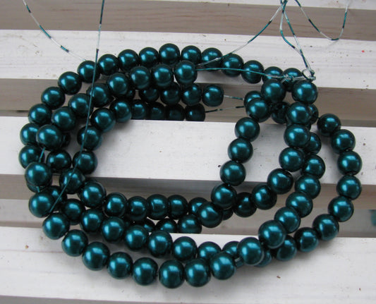 Vaxade glaspärlor - Mörk teal  8mm 1 sträng