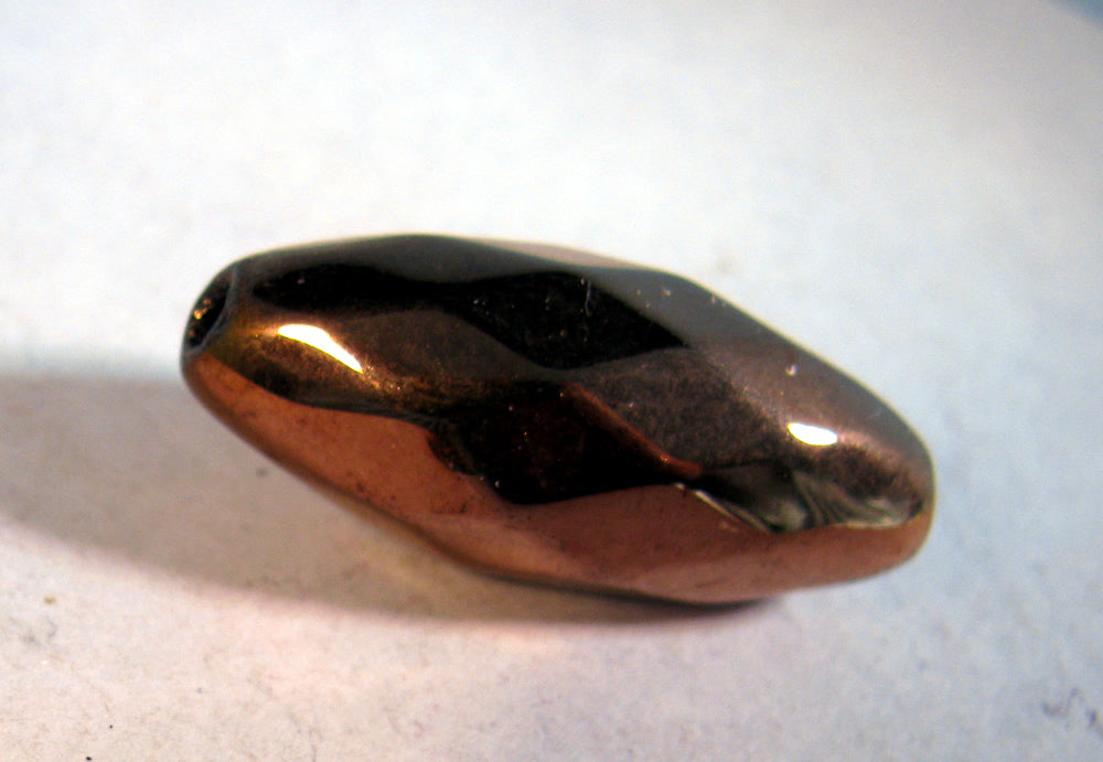 Facetterad glaspärla - Oval koppar,28x12mm