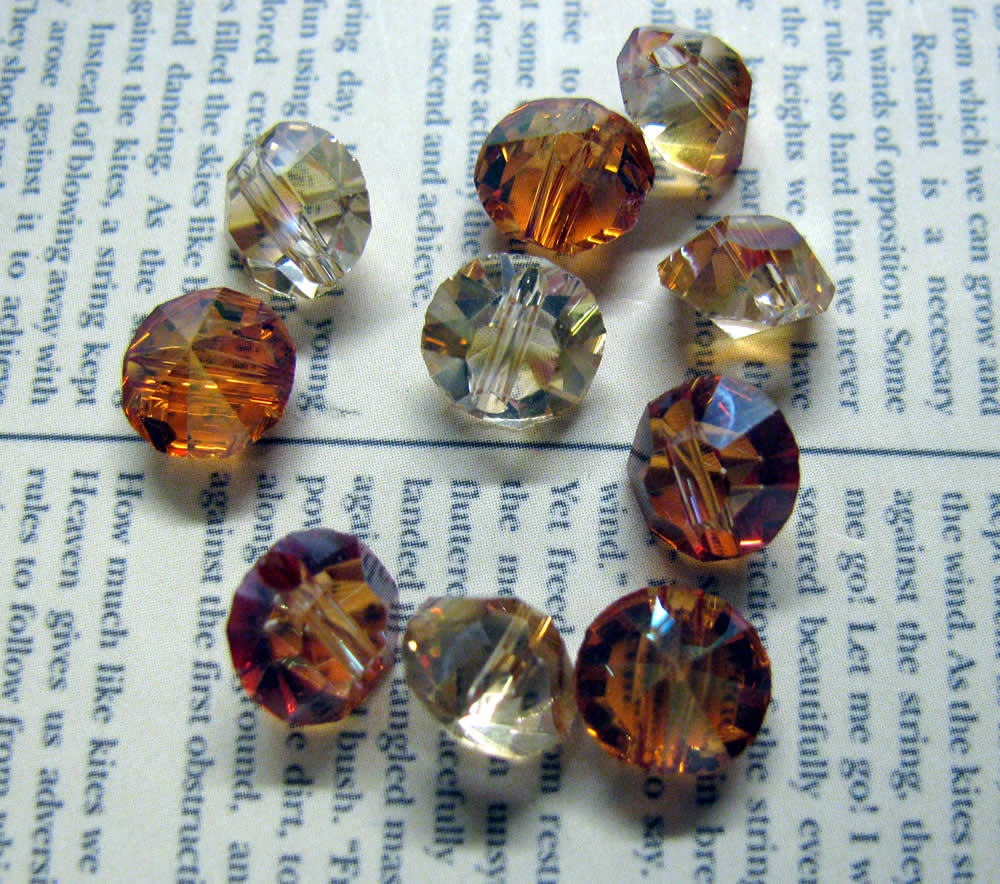 Facetterade glaspärlor - Diamantformade, Gul/orange med lyster, 6x8mm, 10- pack