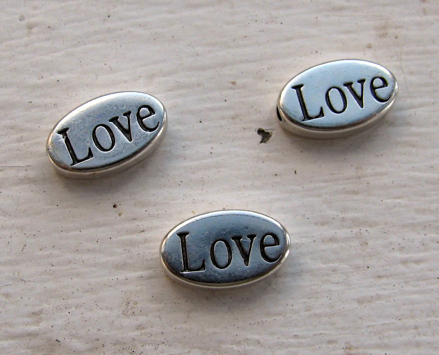 Mellandel silverfärgad - Oval LOVE, 3- pack