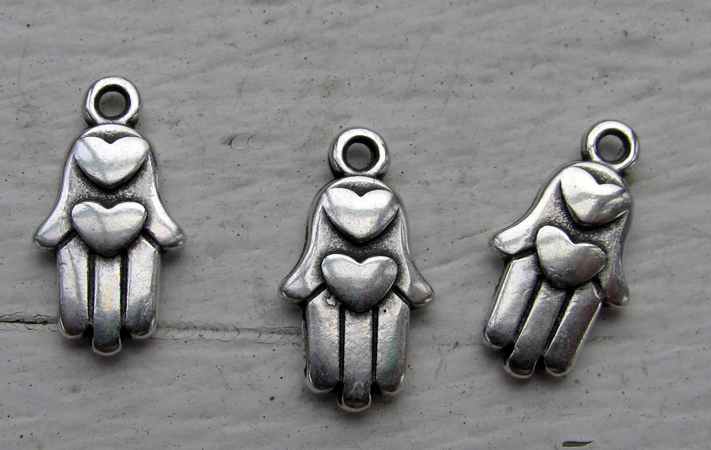 Berlock silverfärgad - Hamsa med hjärta 3- pack