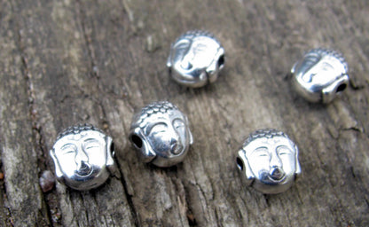 Mellandel Silverfärgad -  Mindre Buddha- huvud 7x5,2mm , 5- pack