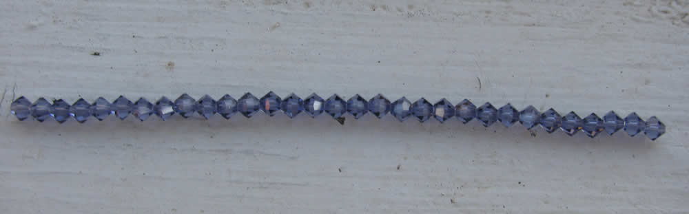 Tjeckiska MC Bicone - Tanzanite 4 mm, 1 sträng