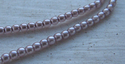 Tjeckiska vaxade glaspärlor - Light Amethyst 2mm, 1 sträng