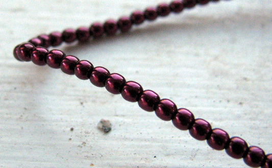 Tjeckiska vaxade glaspärlor - Burgundy 2mm, 1 sträng