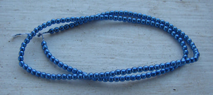 Tjeckiska vaxade glaspärlor - Persian Blue 2mm, 1 sträng