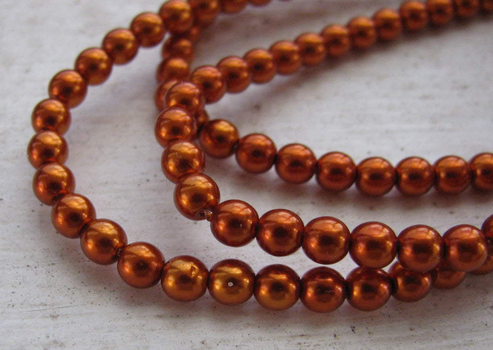 Tjeckiska vaxade glaspärlor - Burnt Orange 4mm, 1 sträng