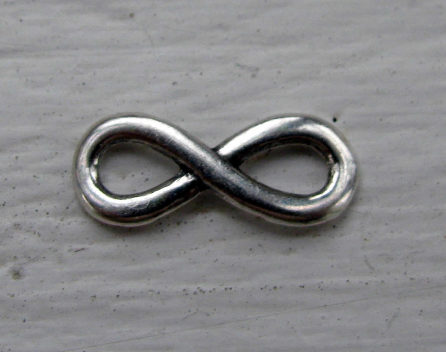 Connector infinity - Evighetstecken liten silverfärgad 15x6mm , 1 styck