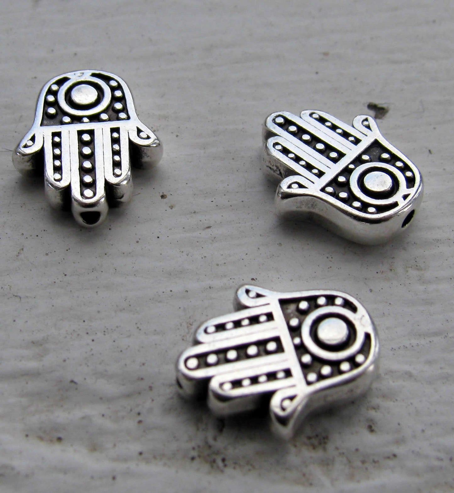 Mellandel silverfärgad - Hamsa hand 12x10mm 3- pack